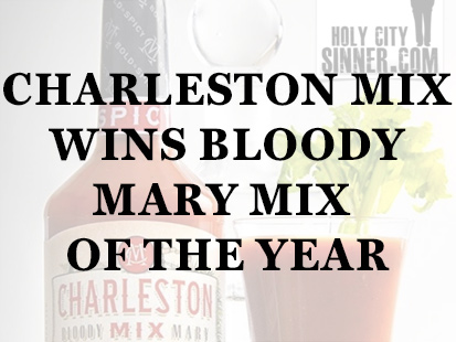 bottle of bloody mary mix next to a glasse of bloody mary mix